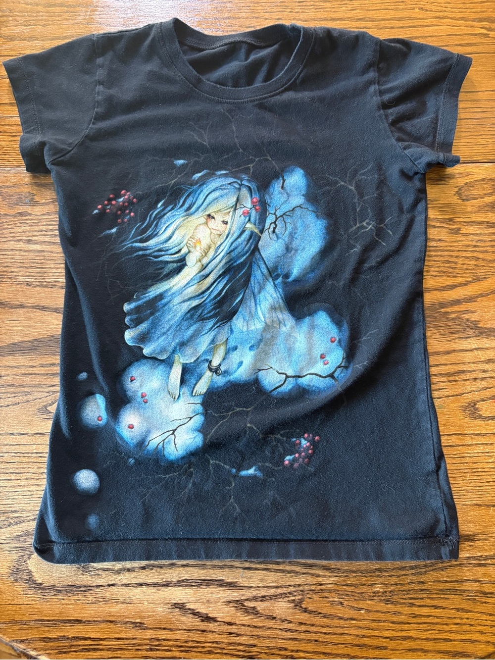 Black Graphic T-Shirt with Blue Fairy Design.